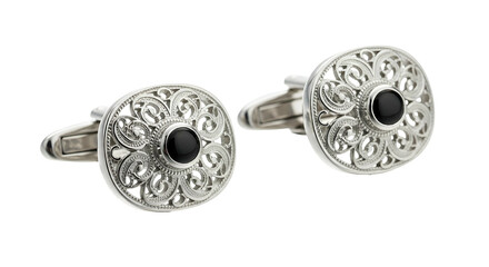 Obraz premium Ornate silver metal fasteners featuring central black gemstone embellishments rest against a dark background.