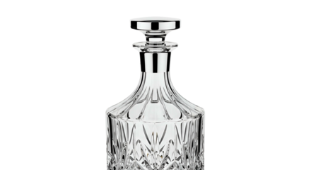 Elegant crystal decanter with polished stopper stands against a stark black background