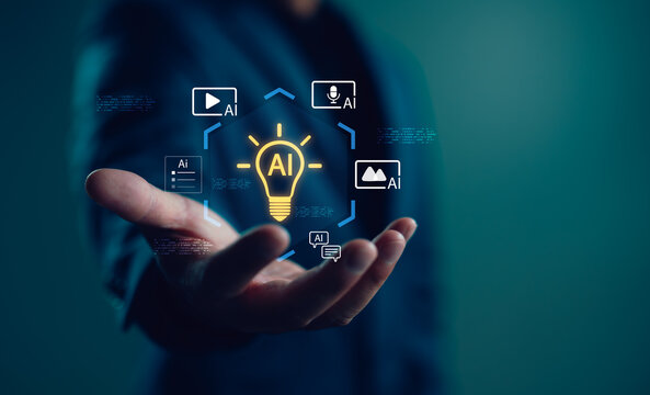 Creative technology concept with AI icon in light bulb and multimedia symbols on businessman’s hand. Represents artificial intelligence in content creation, digital innovation, and smart media tools.