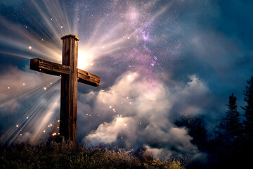 Wooden Christian cross with clouds and mystic background