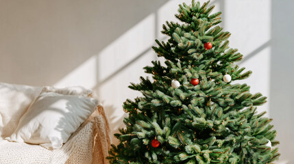 Decorated Christmas tree in an interior — warm shot for holiday, furniture and decor campaigns.