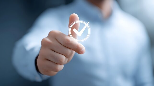 Close up of a finger pressing a digital checkmark symbol conveying a sense of achievement validation and successful task completion in a modern professional context