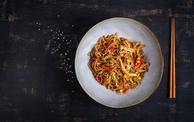 Shirataki noodles stir-fried in spicy soy sauce. Shirataki noodles with shimeji mushrooms. Asian cuisine. Top view.