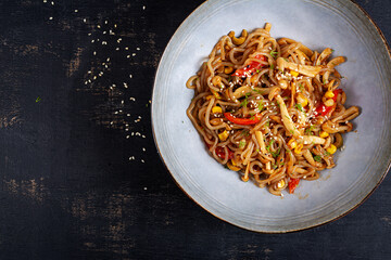 Shirataki noodles stir-fried in spicy soy sauce. Shirataki noodles with shimeji mushrooms. Asian cuisine. Top view.