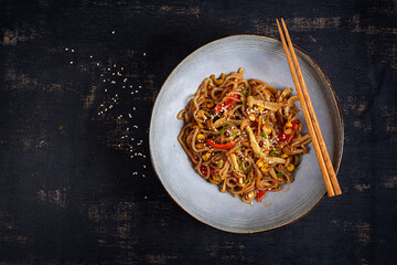 Shirataki noodles stir-fried in spicy soy sauce. Shirataki noodles with shimeji mushrooms. Asian cuisine. Top view.