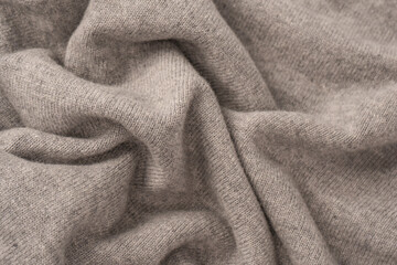 Soft grey merino wool sweater texture as a background.