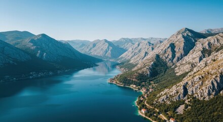 High-angle view of a fjord-like bay, surrounded by mountains