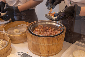 Dumplings in a bamboo steamer