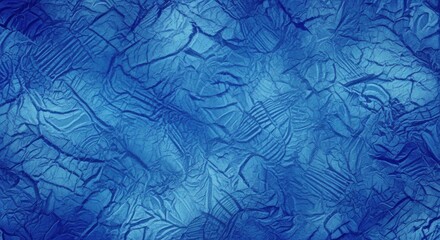 Fototapeta premium A textured blue surface with a pattern of ridges and grooves.