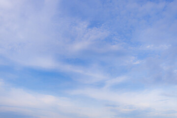 Soft focus cloud and sky background,Soft-focus light blue sky with fluffy white clouds in flowing linear formation, ideal for dreamy, calm, serene, and tranquil backgrounds.