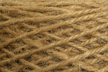 Close-up macro texture of a rope made from bark,Rough knit camel wool fabric texture pattern taken closeup as background.