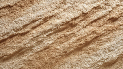Intricate close-up of a naturally aged sandstone surface, featuring detailed porous textures and weathered geological striations in a palette of earthy brown and beige hues
