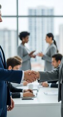 Business Agreement - Handshake in Modern Office Setting.