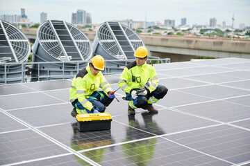Technicians working on solar panels, showcasing renewable energy and sustainable technology