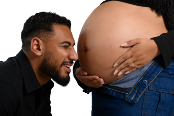 Future father shares tender moment with his pregnant partner's belly.