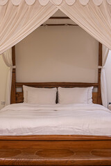 canopy bed with white curtains