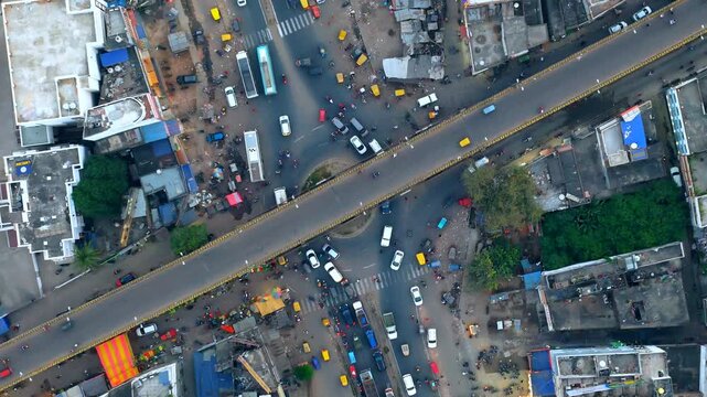 Extreme 4K Top-Down Drone View of Chaotic Indian City Traffic Overpass and Intersection.