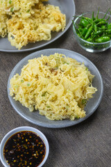 Mendoan Kriuk Baturraden, a dish made from tempeh fried with flour, has a crispy texture. Served with bird's eye chili and soy sauce chili sauce (sambal kecap). indonesia food