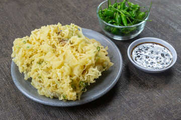 Mendoan Kriuk Baturraden, a dish made from tempeh fried with flour, has a crispy texture. Served with bird's eye chili and soy sauce chili sauce (sambal kecap). indonesia food