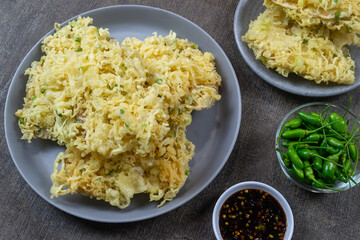 Mendoan Kriuk Baturraden, a dish made from tempeh fried with flour, has a crispy texture. Served with bird's eye chili and soy sauce chili sauce (sambal kecap). indonesia food