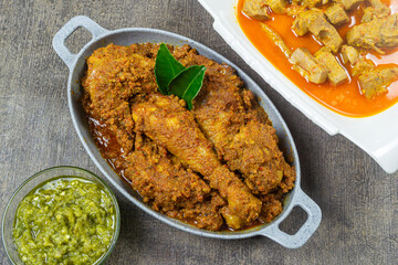 rendang ayam padang, Rendang is one of West Sumatra delicious meat based dishes, served on a gray plate