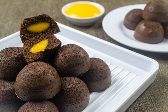 Homemade bakpia kukus keju Jogja served on white plate. A typical Yogyakarta souvenir. It has a soft, melting texture with a savory cheese paste filling