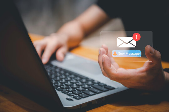 Businessman touching new message notification icon on virtual screen,email alert, online messaging system, representing digital communication, instant response, and business connectivity.