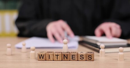 Experience the courtroom atmosphere as a witness prepares to testify and share pivotal information during the proceedings - Powered by Adobe