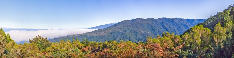 Mountain ridge above clouds on Madeira island Portugal