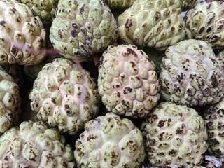 Close up shot of pile of fresh custard apple or sarifa open sell in Indian market.