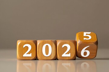 Transition from 2026 to 2025 reflected on wooden blocks
