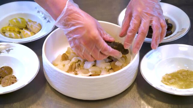 The chef is making delicious sea cucumbers and abalones