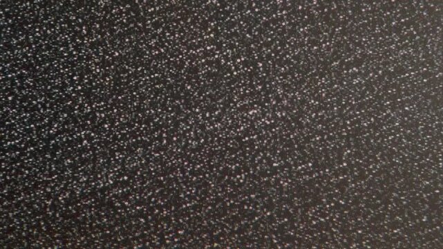 Ethereal White Noise with Interference. Loop. The screen of an old TV, which broadcasts on-air interference inherent in an analog signal - white noise, interlacing, distortion and interference