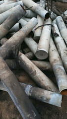 a bunch of shell casings from 100 mm shells, dark-colored photos the war in Donbass