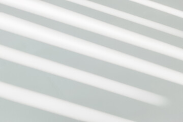 Gray shadow and light blur abstract background on white wall  from window. Dark stripe grey shadows indoor in room  background, monochrome, shadow overlay effect for backdrop and mockup design