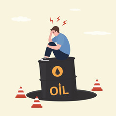 Blind investment concept, businessman sitting on oil barrel failed in pit. Credit pit hole, business trap. Possible failure on commodities market, mistake causing troubles.