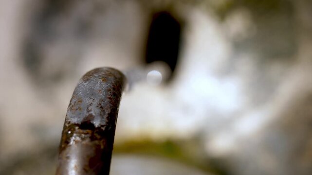 Top view of Roman public fountain with dripping water