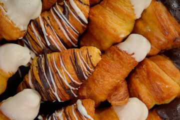 Assorted pastries with chocolate and white icing close-up