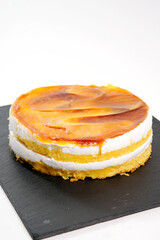 Caramel glazed vanilla sponge cake with cream layers