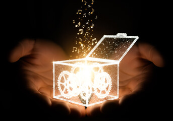 Close up elderly hands passing a tiny music box of light to young hands symbolic memory care tenderness culture wisdom