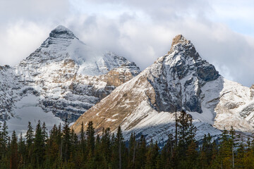 Scenic road toward snowy peaks on Icefields Parkway in Alberta
