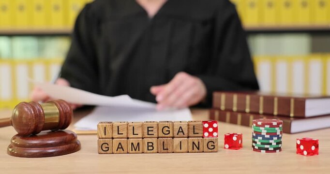 Judge reviews case on illegal gambling in courtroom with dice and gavel displayed prominently