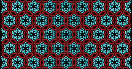 Bold floral geometric pattern in turquoise and red, arranged in a seamless symmetrical layout with stylized petals and dark background for a striking decorative look.