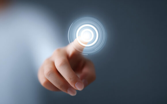 Human finger ready to touch glowing virtual button on screen, concept of future technology, control, and interaction with modern digital interface