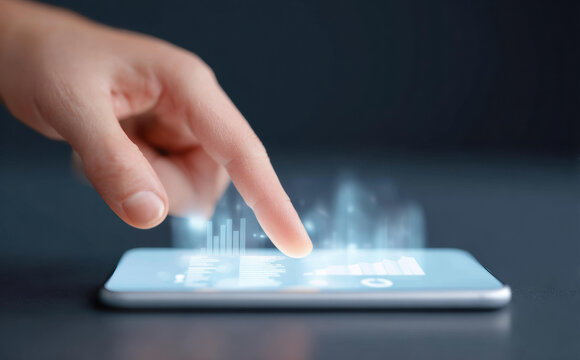 Close up of finger touching smartphone screen with glowing digital interface. Human hand interacting with future technology, representing connection and innovation