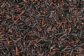 Black rice as a background. Top view. Flat lay