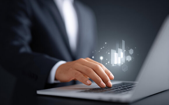 Focused professional businessman working with technology on laptop. work involves data analysis, business finance, and digital chart for report