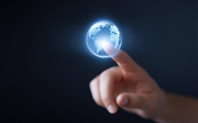 Human finger touching glowing digital earth globe on dark background. concept of global business, communication, technology, and future innovation, expressing hope