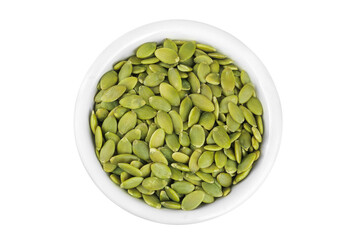 Peeled pumpkin seeds in ceramic bowl isolated on white background. Top view. Flat lay