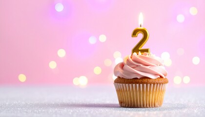Sweet pink frosted cupcake with a glowing number two candle, perfect for celebrating a second birthday or anniversary against a charming bokeh background